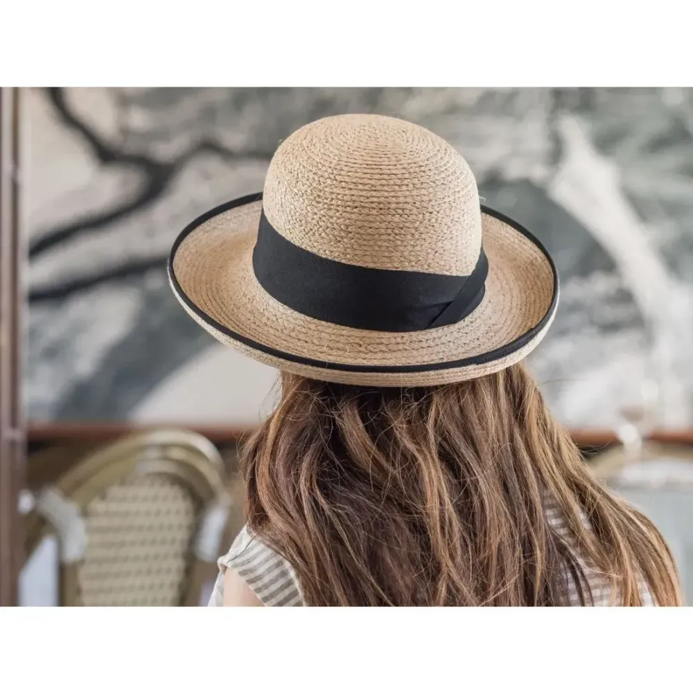 Person wearing Tilley Rebecca Straw Sun Hat